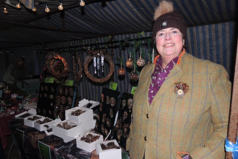Handmade feather artist Caroline Pont, of Boothby Graffoe at the Navenby Christmas market event, selling her feather brooches and baubles.