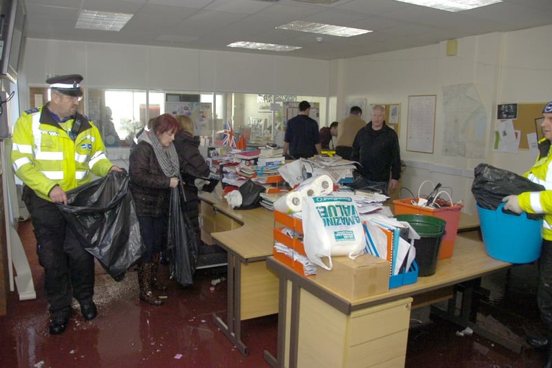 Staff and volunteers clearing out the Boston Standard office.