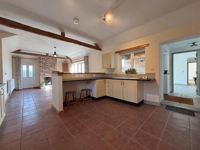 The adjacent kitchen area.