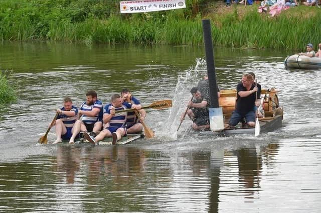 Competitors in the raft race give it their oar-ll.