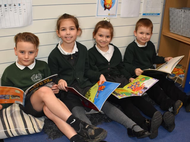 Children pick a book to enjoy on World Book Day.