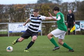 A rare sight in recent weeks - Louth Town in competitive action.