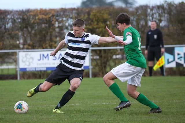 A rare sight in recent weeks - Louth Town in matchday action.