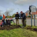 Volunteers dig in on the corner of Legsby Road and Willingham Road.