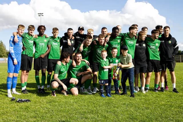 Sleaford Town celebrate their South Kesteven Charity Cup success. Photo: Steve W Davies Photography.
