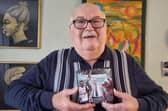 Tom Hedges holds a photograph of the picture when he was vindicated of his convictions at the Court of Appeal.