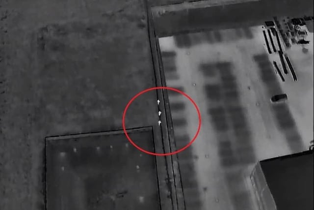 A screenshot of the drone footage showing the offenders (circled) attempting to escape. Photo: YouTube