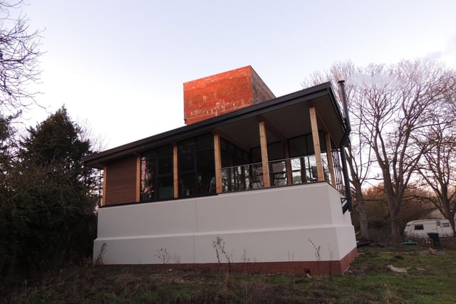 The modern living area has been built on the foundations of the old water holding tank, which was in a poor state.