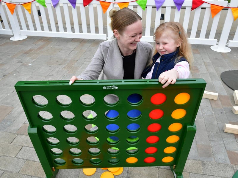 Charlotte Price and Selena Smith 5 of Sleaford try the garden games at the Easter Garden. Photo: David Dawson