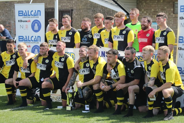 Wyberton line up with the Lincs League trophy.