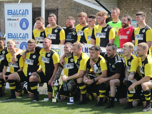 Wyberton line up with the Lincs League trophy.