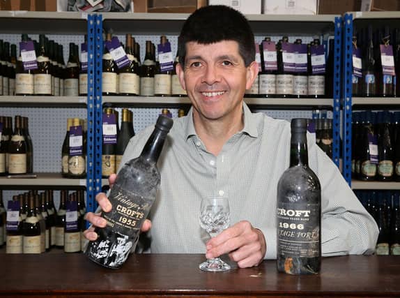 Paul Cooper with two bottles of vintage port that have a combined age of 129 years!