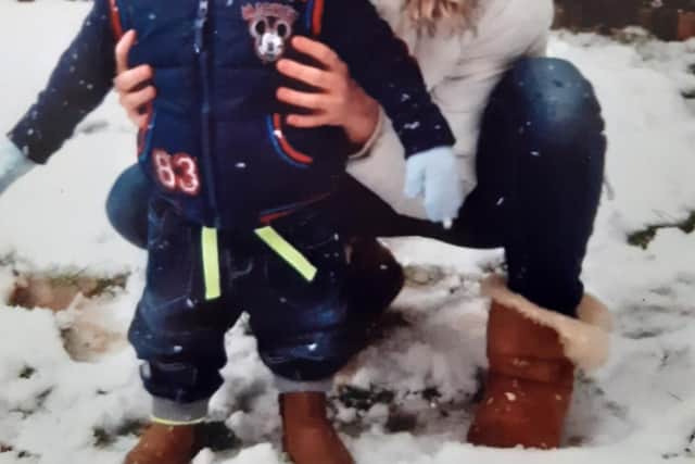 Bethany with baby DJ in the snow. Photo: Caroline Vincent