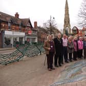 Sleaford Museum and Civic Trust members and volunteers with the new mosaic and renovated towns signs.