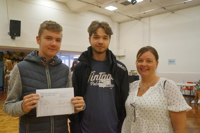 Evan Wing, left, took advantage of the extra revision times and boosted his predicted 3s and 4s to 5s, 6s and 7s. He is pictured with brother Owen, who last week collected his results, and mum Tamara Crewe.
