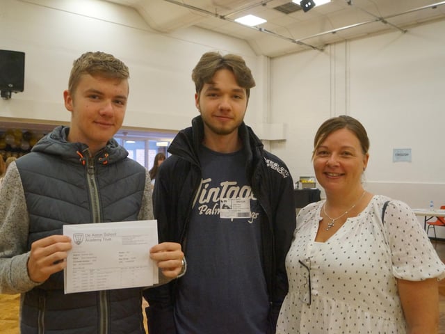 Evan Wing, left, took advantage of the extra revision times and boosted his predicted 3s and 4s to 5s, 6s and 7s. He is pictured with brother Owen, who last week collected his results, and mum Tamara Crewe.
