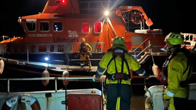 Still shot from the helmet camera on board Skegness RNLI during the transfer with Humber RNLI.