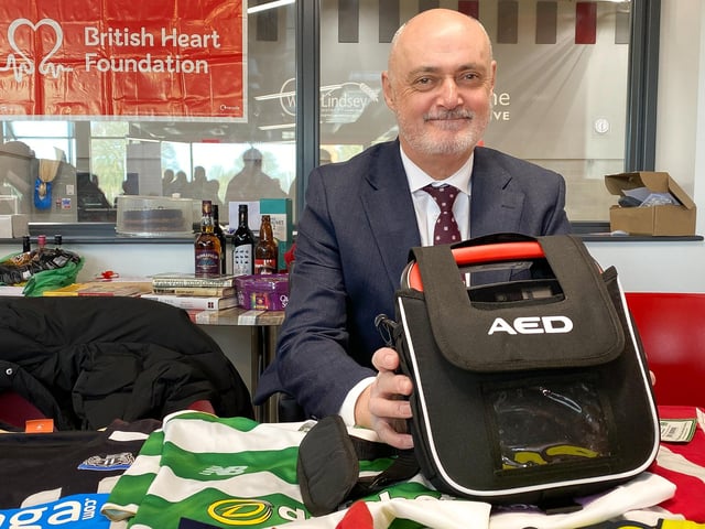 Tony Fenton with the portable defibrillator he has sponsored for the Wolds Wanderers