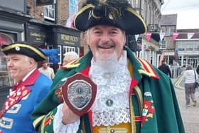 Sleaford Town Crier John Griffiths with his trophy.