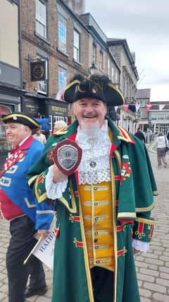Sleaford Town Crier John Griffiths with his trophy.