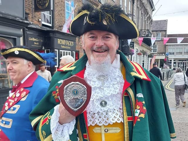 Sleaford Town Crier John Griffiths with his trophy.