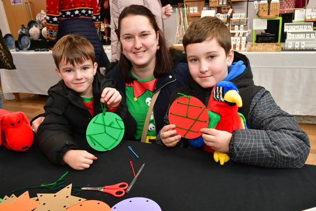 Ethan Harrison, six, Carly Harrison and Isaac Harrison, eight, of Sleaford, making baubles at the Hub's makers market.
