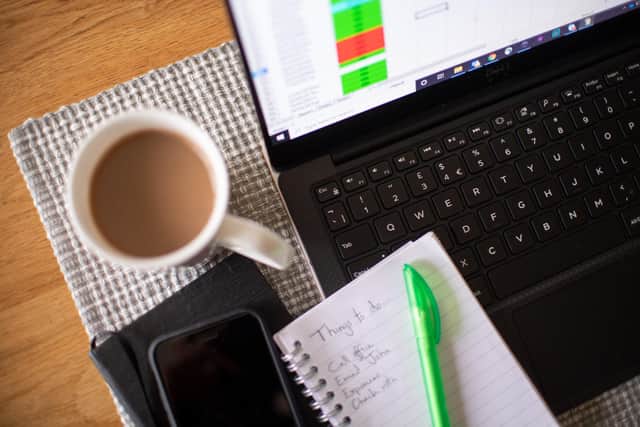 Stock photo of a laptop on a dining room table set up as a remote office to work from home. Workers told to self-isolate due to coronavirus will receive sick pay from day one, the Prime Minister has announced, as England's Chief Medical Officer warned that a UK epidemic is now "likely".
