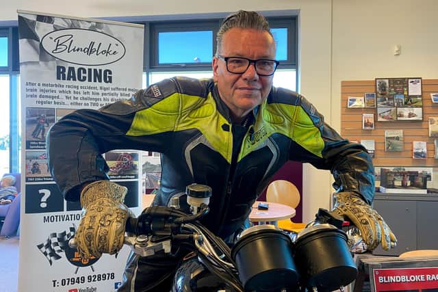 Nigel Limb Recordbreaking Blind Motorcyclist on his Triumph Motocycle in Mablethorpe Library. Photo by Chris Frear