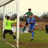 Charlie Ward gets up to head home the equaliser against Belper. Photo: Steve W Davies Photography.