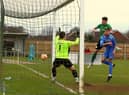 Charlie Ward gets up to head home the equaliser against Belper. Photo: Steve W Davies Photography.