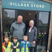 Osbournby village shop keepers Ian and Janey with the visiting reception children from Osbournby School.