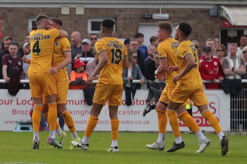 Keaton Ward is mobbed after equalising for Boston.