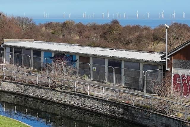 GOING - The beach chalets before the demolition. Photo: Barry Robinson
