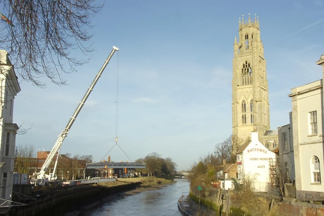 Boston's St Botolph's footbridge being removed with the aid of a crane. Workers dismantled the bridge before the middle section was craned to nearby Lawrence Lane. The bridge was due to be replaced with a new £750,000 structure, part-funded by the European Union.
