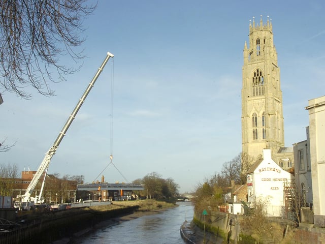 Boston's St Botolph's footbridge being removed with the aid of a crane. Workers dismantled the bridge before the middle section was craned to nearby Lawrence Lane. The bridge was due to be replaced with a new £750,000 structure, part-funded by the European Union.