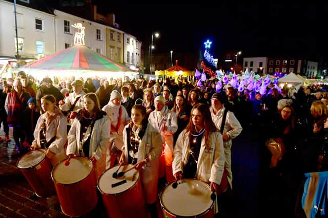 Crowds gather in the Market Place for the Illuminate Festival and Christmas Market.