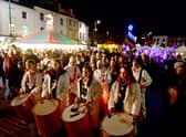 Crowds gather in the Market Place for the Illuminate Festival and Christmas Market.