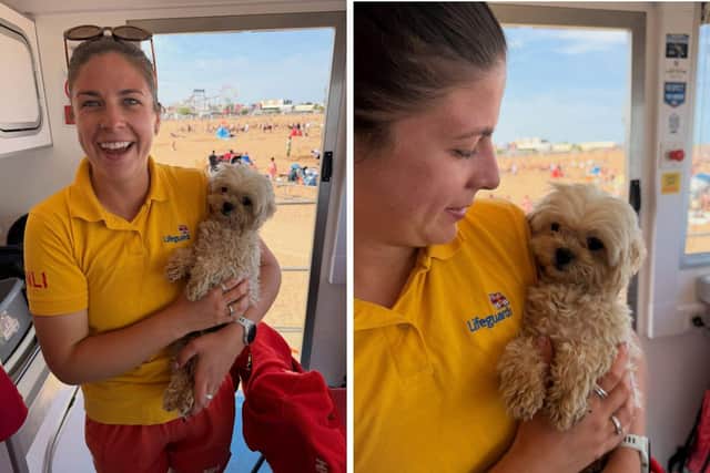One of the RNLI Lifeguards at Skegness beach with the little dog they helped.