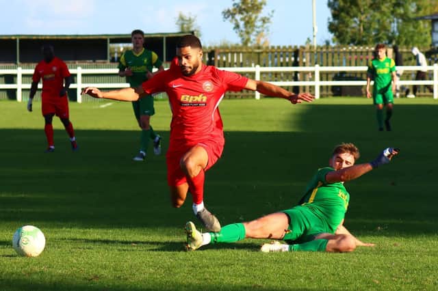 Action from Sleaford Town's (in red) win over hosts Holwell Sports. Photo: Steve W Davies Photography.
