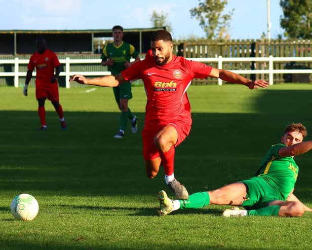 Action from Sleaford Town's (in red) win over hosts Holwell Sports. Photo: Steve W Davies Photography.