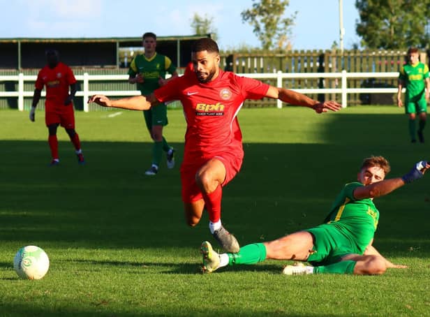 Action from Sleaford Town's (in red) win over hosts Holwell Sports. Photo: Steve W Davies Photography.