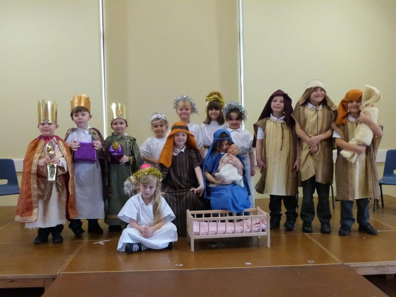 Youngsters at Nettleton Primary School performing Whoops-a-Daisy Angel in the village hall.