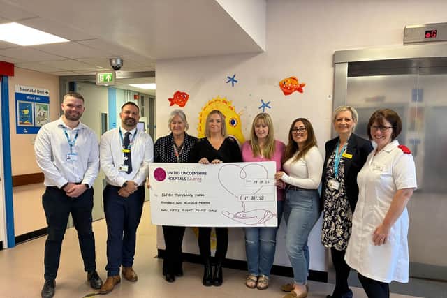 Lincolnshire Community and Hospitals NHS Group Chief Executive, Professor Karen Dunderdale with the team from Ward 4a and United Lincolnshire Hospitals Charity