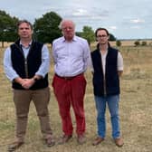 Coun Richard Butroid, Sir Edward Leigh and Henry Morris, whose family owns Gate Burton Hall, at one of the proposed solar farm sites