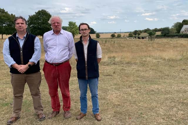 Coun Richard Butroid, Sir Edward Leigh and Henry Morris, whose family owns Gate Burton Hall, at one of the proposed solar farm sites