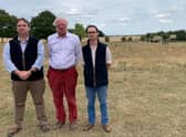Coun Richard Butroid, Sir Edward Leigh and Henry Morris, whose family owns Gate Burton Hall, at one of the proposed solar farm sites