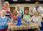 Enjoying some tea and biscuits at Trusthorpe village hall's warm space. Photo: Chris Frear