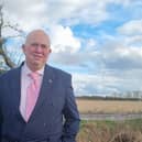 Coun Colin Davie near a site in Burgh le Marsh earmarked for pylons.