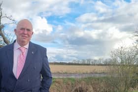 Coun Colin Davie near a site in Burgh le Marsh earmarked for pylons.