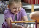 Brookylyn, a patient at St Andrew's Hospice having fun in the sensory room.